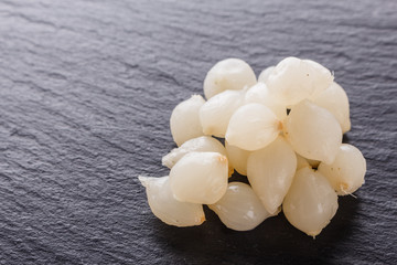 pickled vegetables on a dark stone background