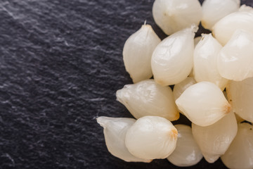 pickled vegetables on a dark stone background