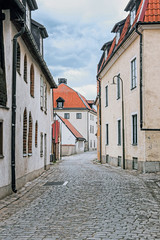 Fototapeta na wymiar stone street with old building in Visby old town