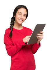 Smiling teenager using her tablet