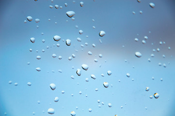 small drops of water on the glass, the concept of rainy weather