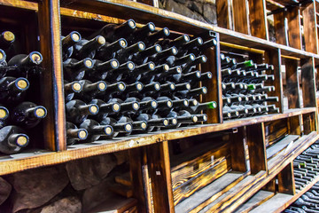 wine cellar glass bottles barrels dark and damp