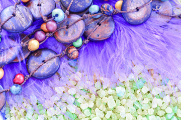 Obraz na płótnie Canvas Colorful Beads from Coconut and Acai Berry on Crystals of Bath Sea Salt for Spa