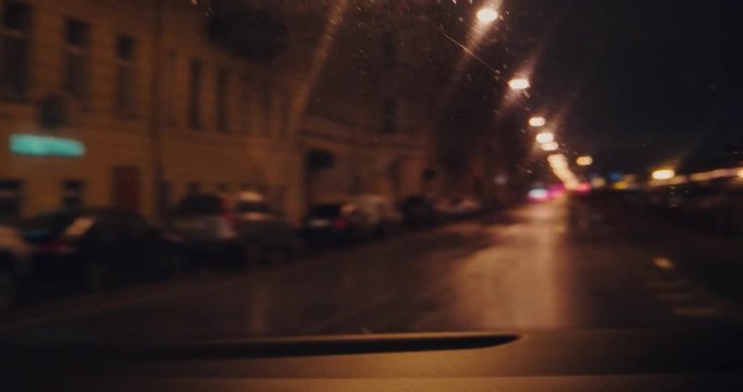 defocused night city, the car is turning right