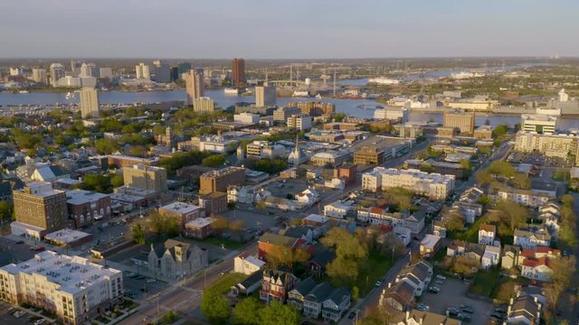 Aerial perspective flying into the downtown urabn core of Portsmouth Virginia