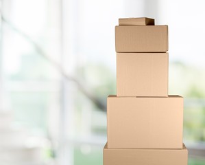 Man with cardboard boxes on background