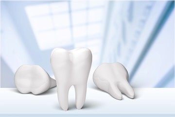 Big teeth, toothbrush and dentist mirror in dentist clinic on background
