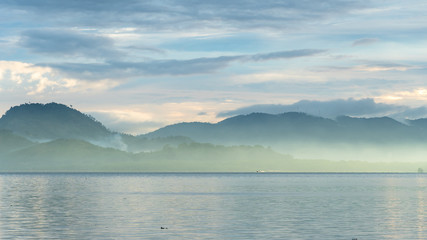 Landscape of clouds over the sea at sunrise © khamkula