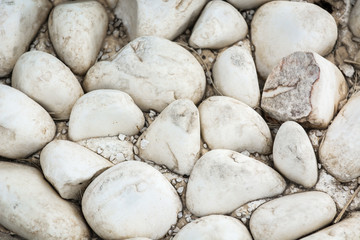 Fototapeta na wymiar White smooth stones by the sea.