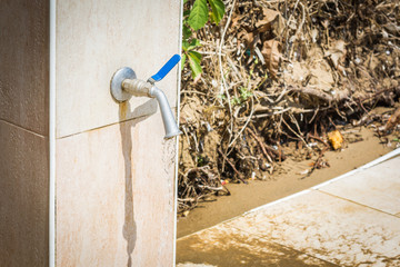 Faucet with foot wash valve on beach.