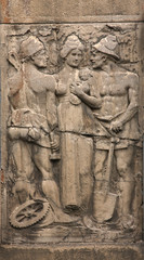 Bas-relief of workers and woman on the building wall