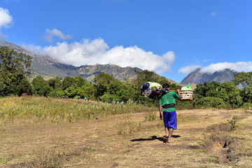 Porters helping hiker to carry stuff druing Hiking Mount Rinjani in Lombok Island, Indonesia