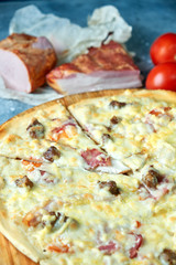 Slice of hot pizza large cheese lunch or dinner crust seafood meat topping sauce. with bell pepper vegetables delicious tasty fast food italian traditional on wooden board table classic in view