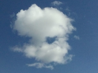 Gray clouds in blue sky In bright sunlight.
