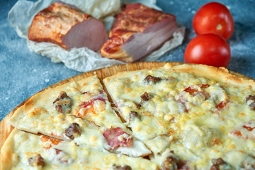 Slice of hot pizza large cheese lunch or dinner crust seafood meat topping sauce. with bell pepper vegetables delicious tasty fast food italian traditional on wooden board table classic in view
