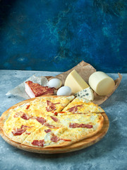Slice of hot pizza large cheese lunch or dinner crust seafood meat topping sauce. with bell pepper...