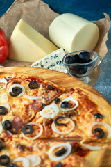 Slice of hot pizza large cheese lunch or dinner crust seafood meat topping sauce. with bell pepper...