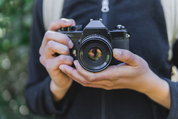 Young woman holding a camera