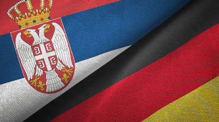 Serbia and Germany two flags textile cloth, fabric texture