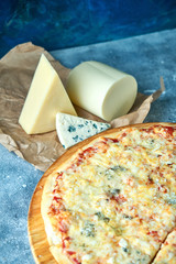 Slice of hot pizza large cheese lunch or dinner crust seafood meat topping sauce. with bell pepper...