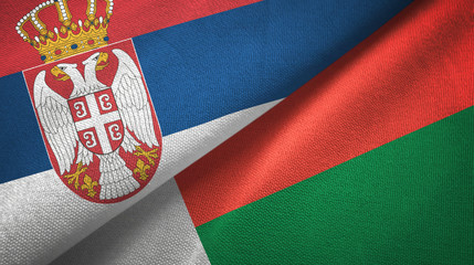 Serbia and Madagascar two flags textile cloth, fabric texture