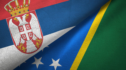 Serbia and Solomon Islands two flags textile cloth, fabric texture
