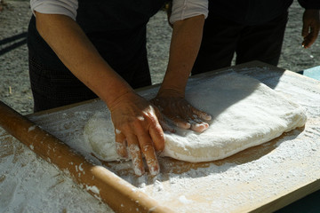 Mochi being pushed flat ready to make into mochi balls