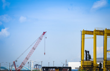 Crane and container ship in export and import business and logistics in harbor industry