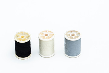 Multi-colored thread for sewing ,white background.