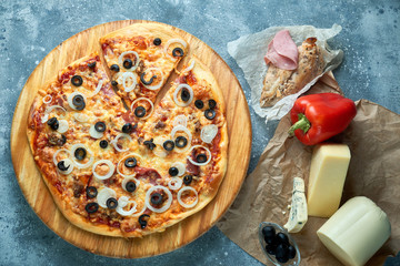 Slice of hot pizza large cheese lunch or dinner crust seafood meat topping sauce. with bell pepper...