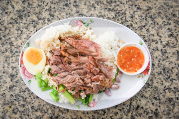 Stewed leg pork and Chinese Kale with sweet gravy sauce style chinese food on plate with egg