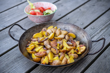 grilled potatos with onionin and salad