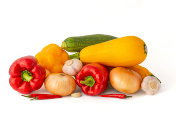 Vegetable set of bright ripe appetizing fruit peppers onion zucchini and garlic