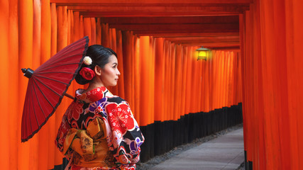 Women in traditional japanese kimonos walking at Fushimi Inari Shrine in Kyoto, Japan, Kimono women...