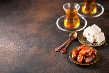 Dried dates and tea in the glasses