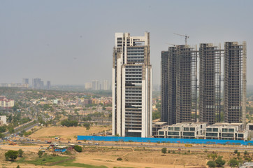 Aerial shot of highrise luxury apartments/office with under construction buildings at the background in Delhi NCR, Mumbai, Pune, Hyderabad, Lucknow, Jaipur, Kolkata, Noida, Gurgaon, Chennai, Bangalore
