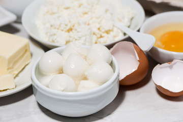 fresh farm dairy products and bread on white table