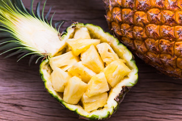 Pineapple tropical fruit ripe fresh on the wood texture background