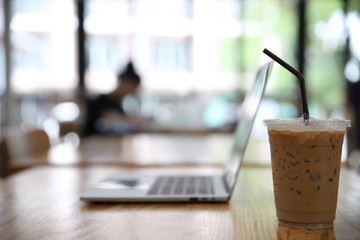 Iced Coffee with laptop background,