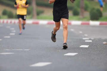 Group of people running race marathon