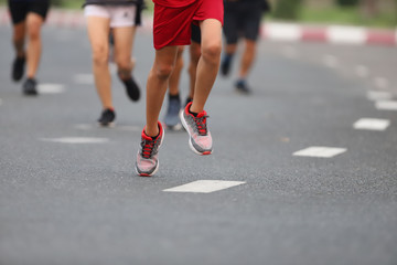 Group of people running race marathon