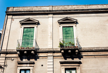 Decoration stucco of balcony in old baroque building in Catania, traditional architecture of Sicily, Italy.
