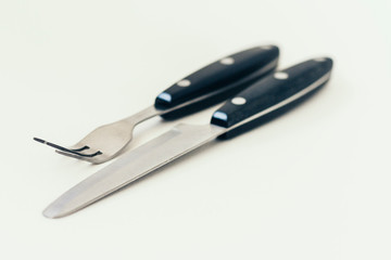 Close up knife and fork isolated on white background.