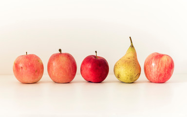 Fresh ripe pear and apples  on white background, vegetarian concept.