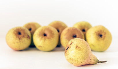 Fresh ripe pears on white background, vegetarian concept.