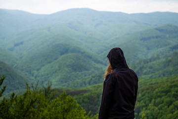 Girl looking at a mountain
