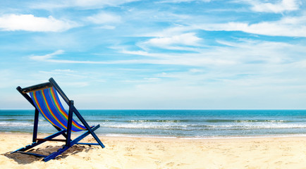 Fototapeta na wymiar View of the chair on the beach, blue sky Summer vacation concept Consists of travel websites
