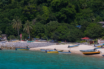 Fototapeta na wymiar Boats at the beach during daytime.