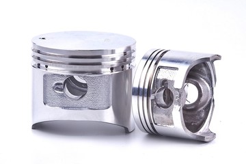 The piston of the engine is on a white background.