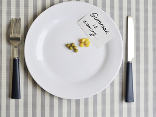 Conceptual image of diet theme. Plate with some food on stone background.